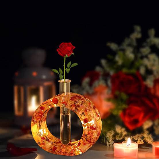 Amber circular floral holder with a red rose