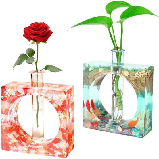 Two colourful square floral holders with glass inserts