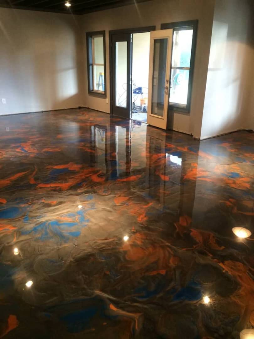 Glossy floor with copper, charcoal and blue swirls in an open room